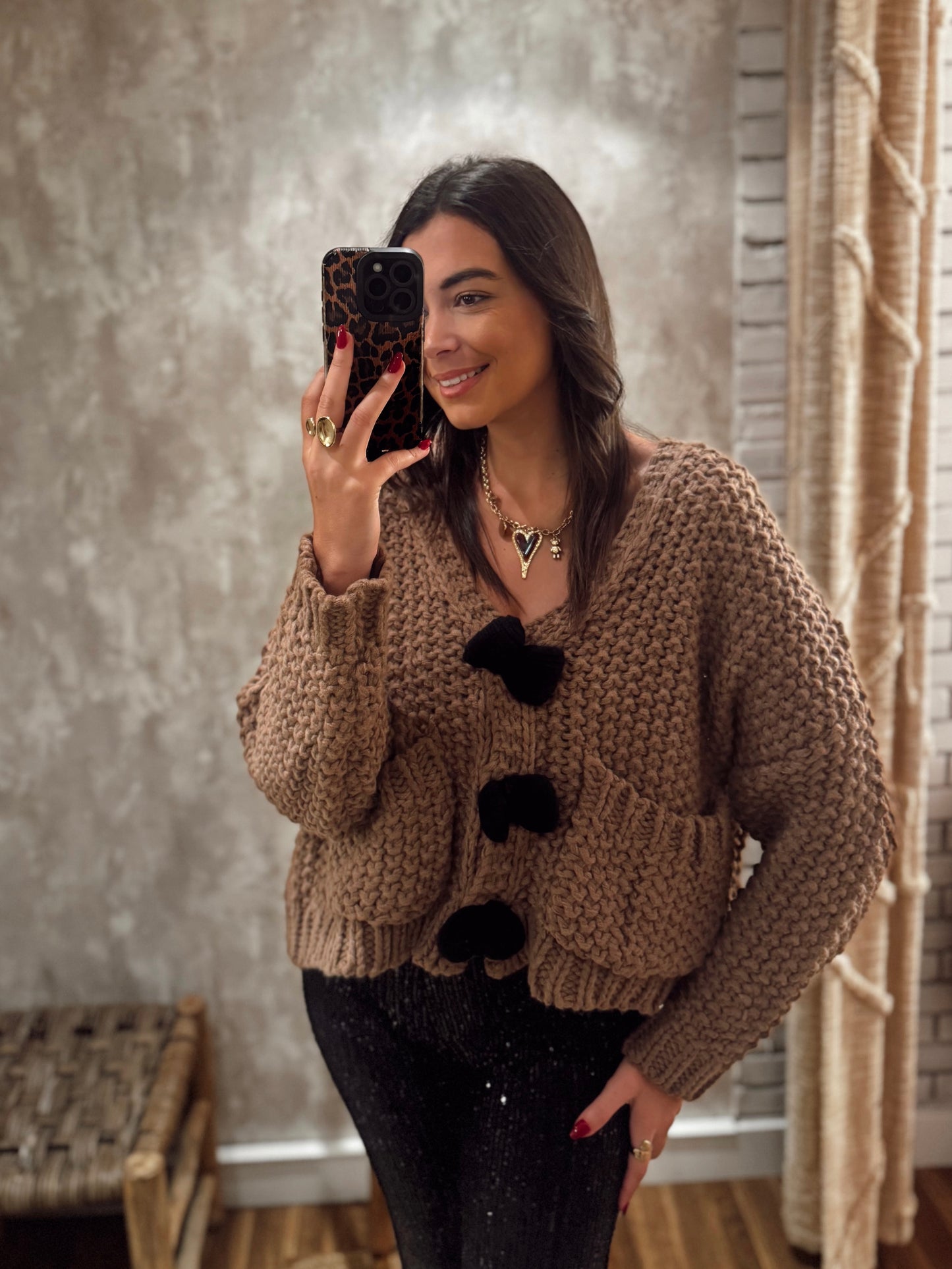 Casaco de malha grossa com textura e laços