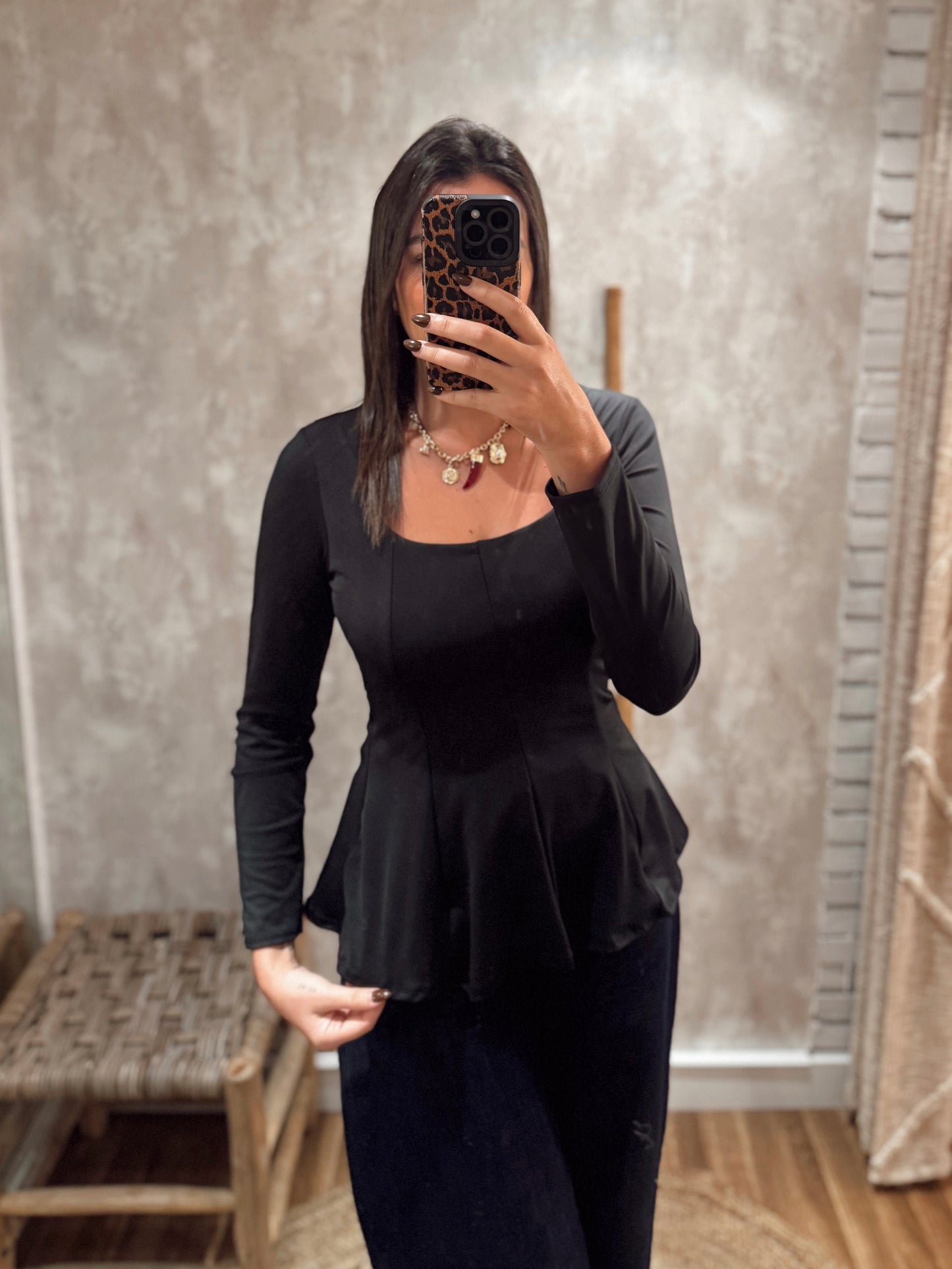 Blusa em lycra com efeito peplum