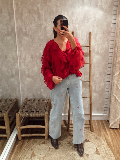 Jeans de ganga com laços bordados